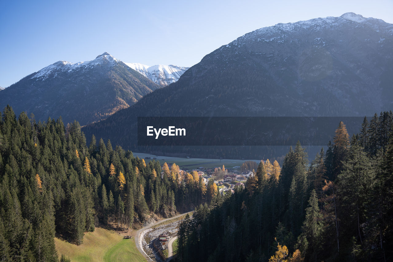 panoramic view of trees and mountains against sky