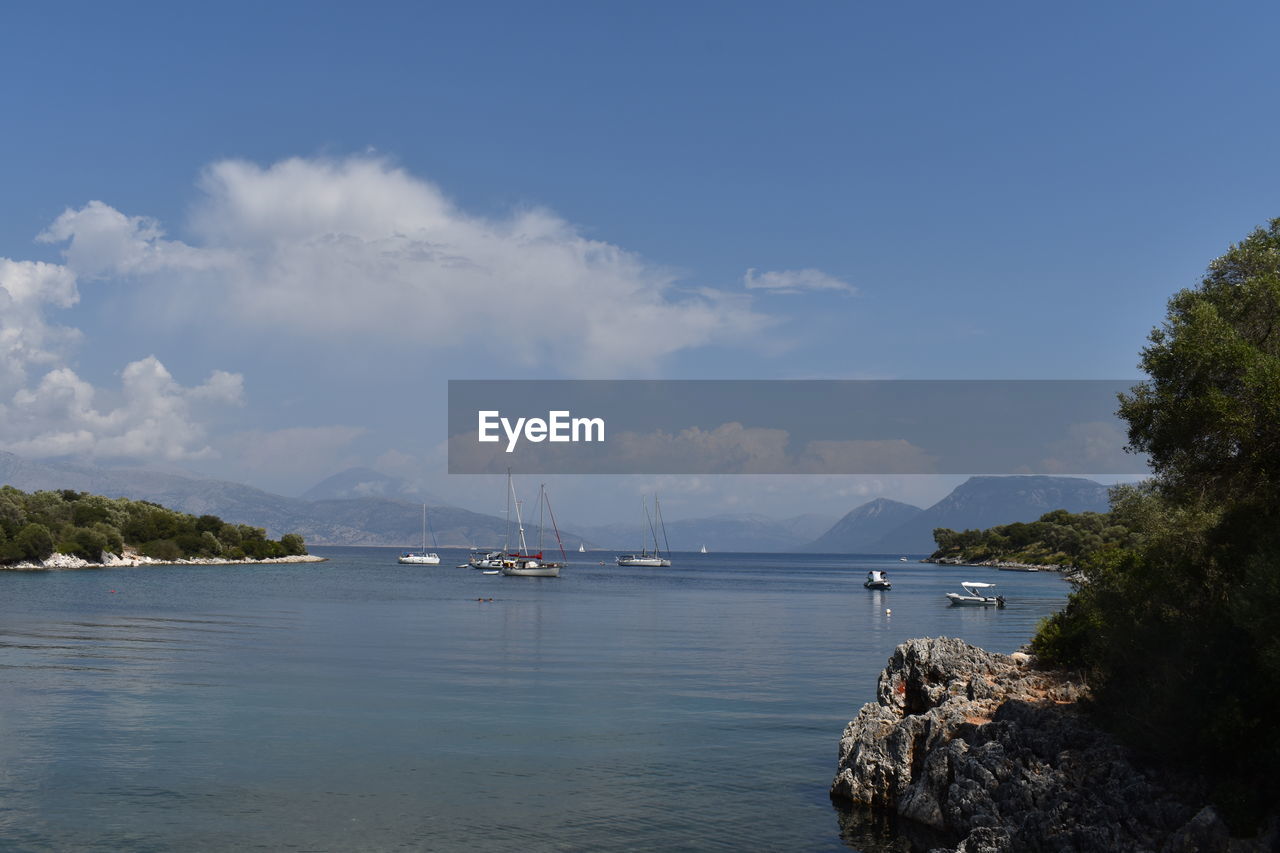 water, sky, sea, nautical vessel, transportation, body of water, cloud, nature, shore, scenics - nature, coast, beauty in nature, bay, mode of transportation, sailboat, travel, land, beach, ship, travel destinations, tranquility, tree, tranquil scene, no people, blue, day, environment, plant, ocean, vehicle, tourism, vacation, holiday, trip, mountain, outdoors, harbor, sailing, idyllic, landscape, bay of water, coastline, architecture, boat, horizon, yacht, non-urban scene, sailing ship, reservoir, island, cove