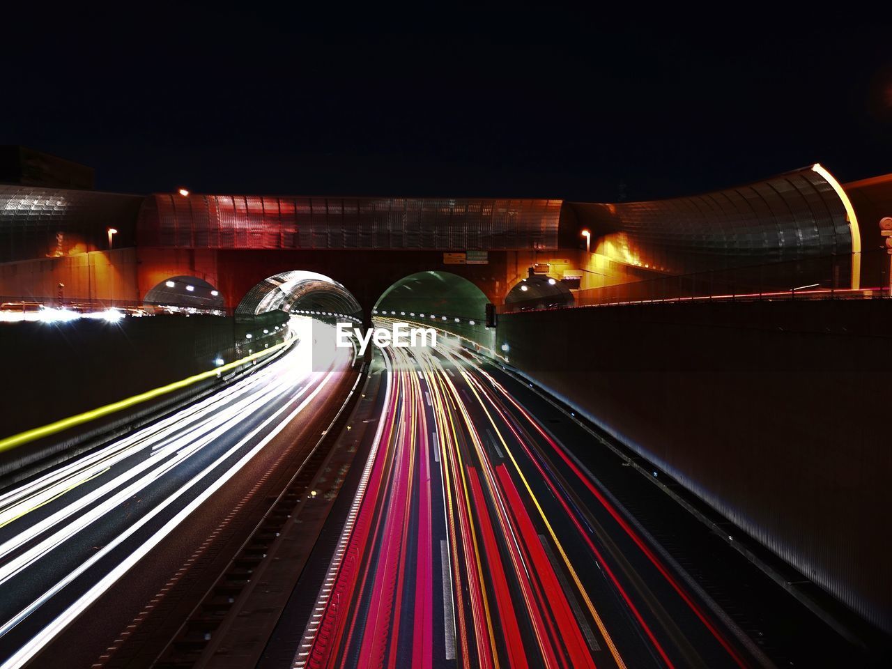 Light trails on road in city at night