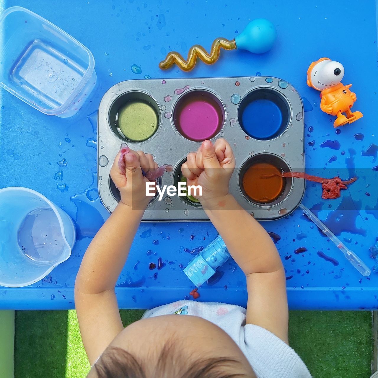 Sensory play with water and paint colours
