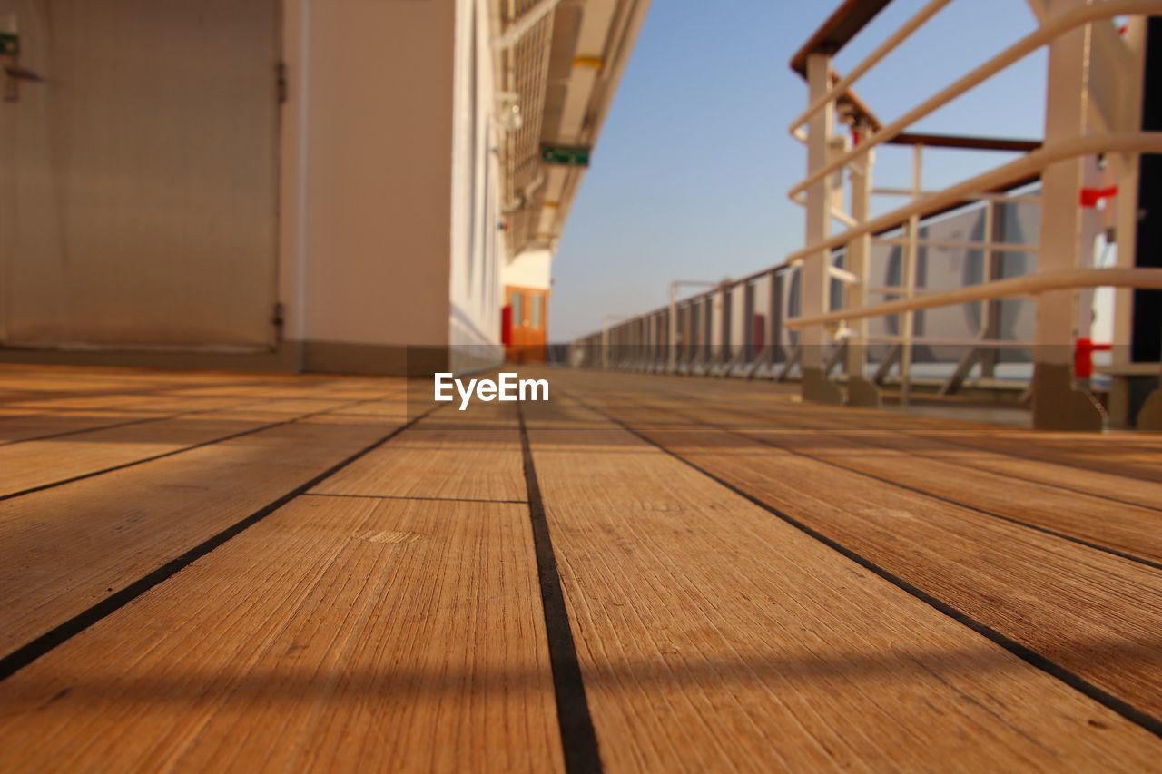 SURFACE LEVEL VIEW OF EMPTY WOODEN FLOOR IN BUILDING