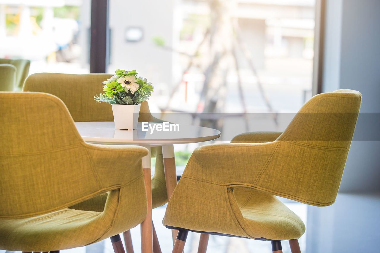 Close-up of empty chairs and table arranging at restaurant