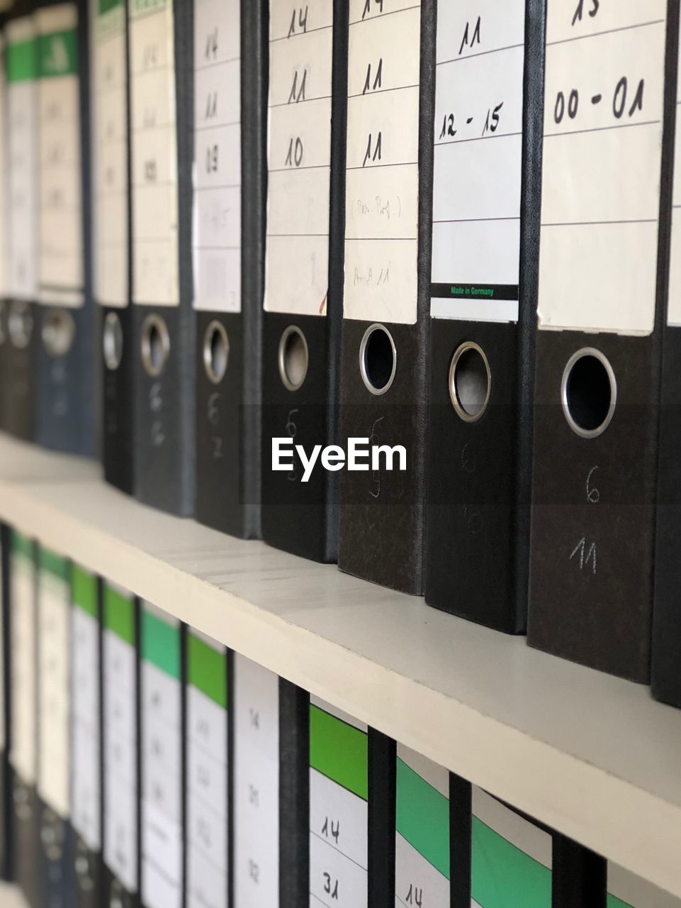 Full frame shot of files on shelf in office