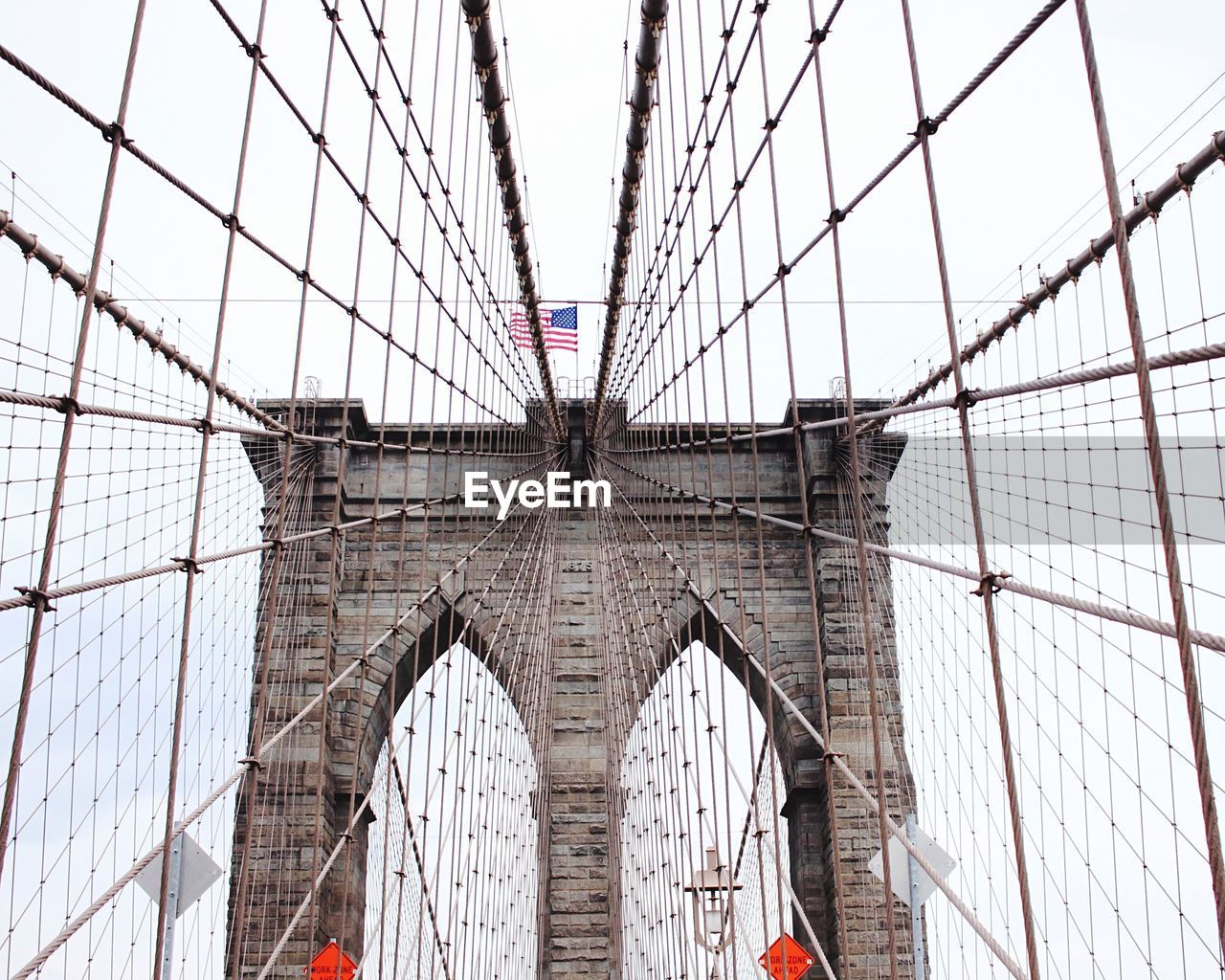 Low angle view of brooklyn bridge against clear sky