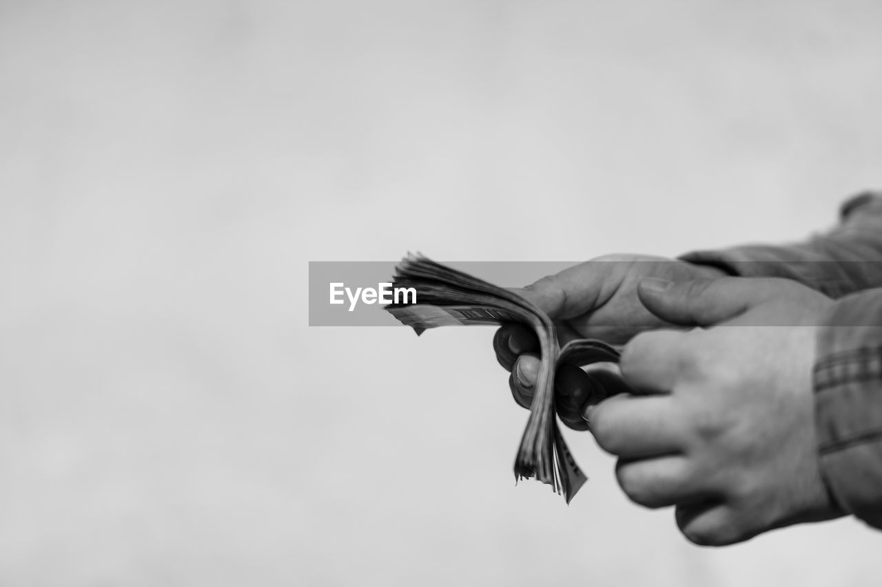 hand, close-up, holding, adult, one person, copy space, men, black, focus on foreground, monochrome, black and white