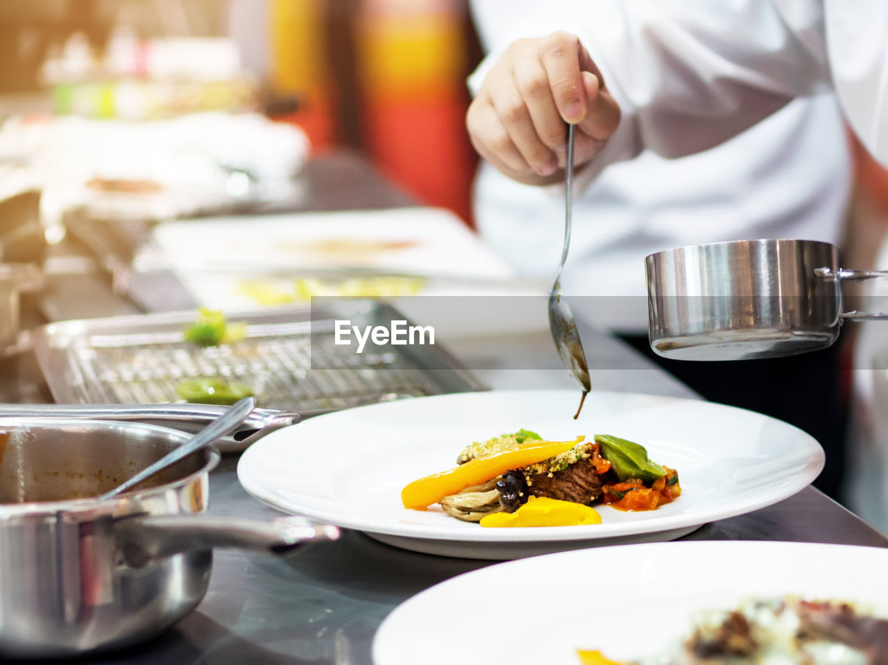 midsection of woman having food at restaurant