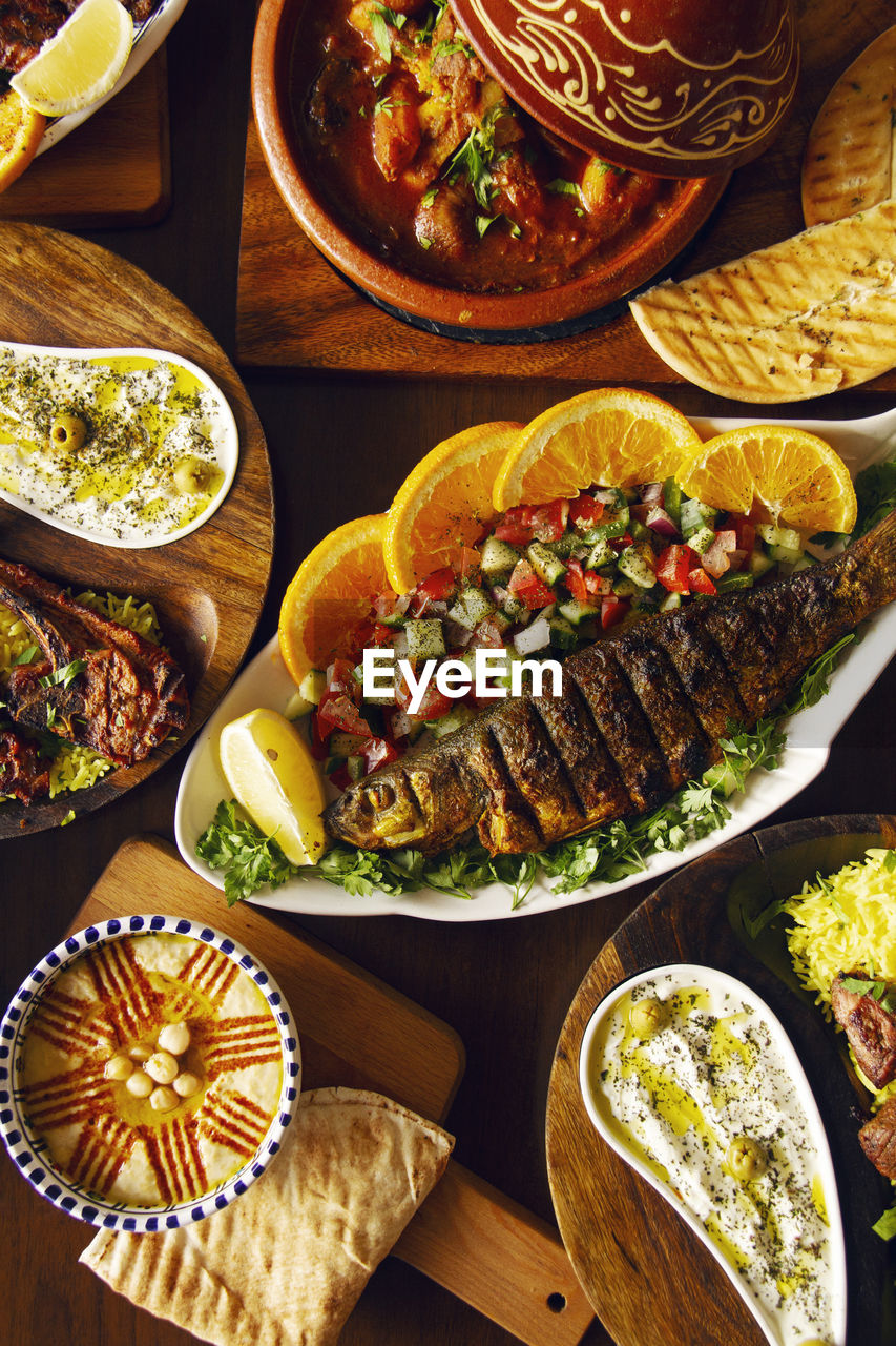 Directly above shot of various food served on table