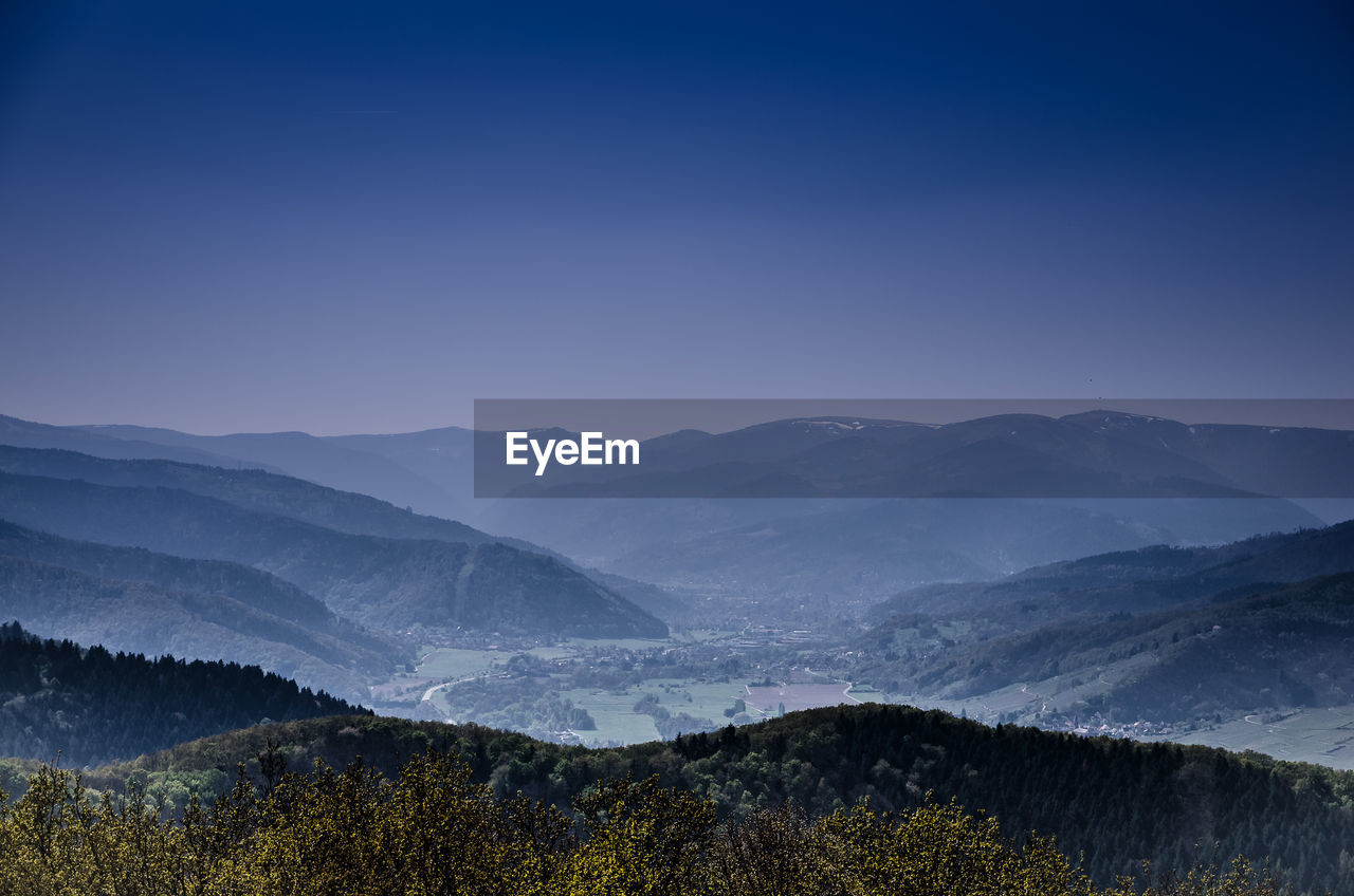 Scenic view of mountains against sky at night