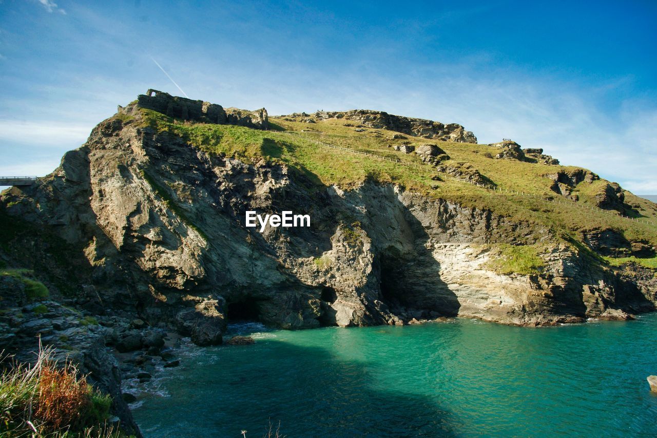 Scenic view of sea and rocks against sky