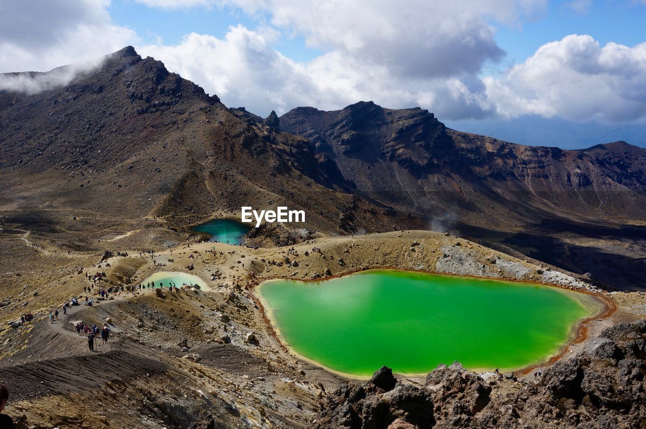 Aerial view of mountain range against sky and volcanic lakes 