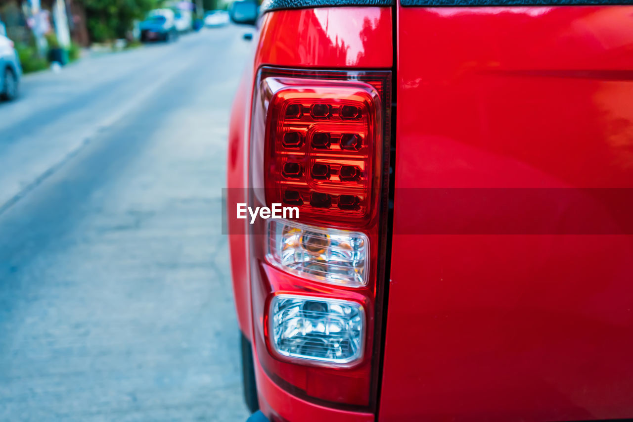 Close up back view red tail lights of red pick-up