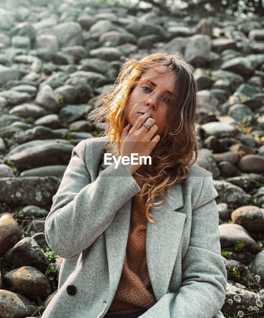 Portrait of woman on rock