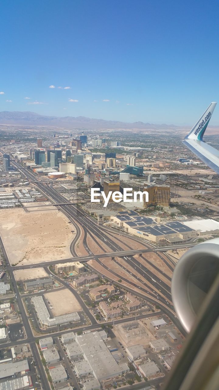 AERIAL VIEW OF CITY AGAINST SKY