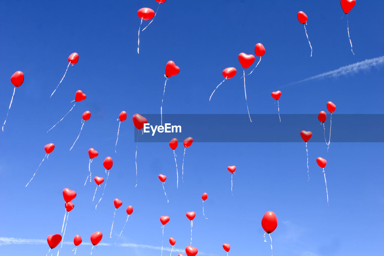 low angle view of balloons against clear sky
