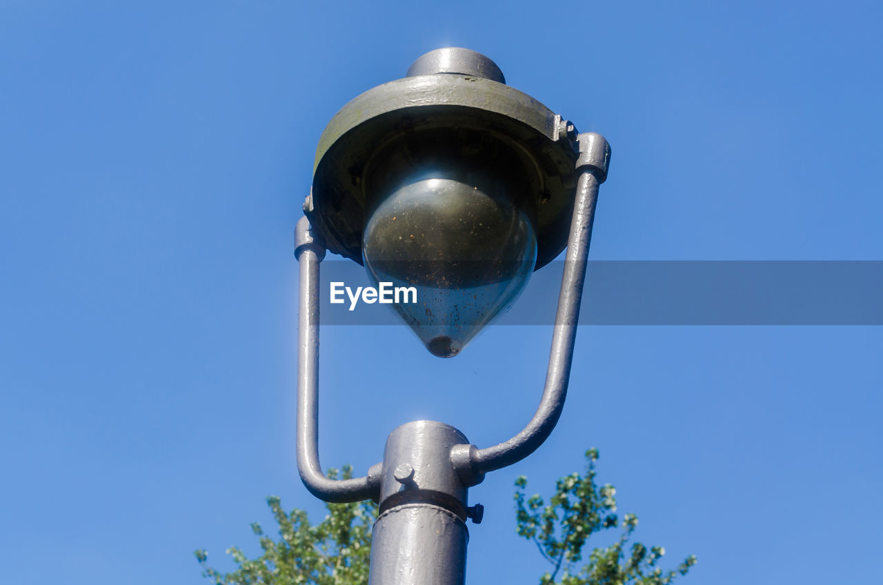 LOW ANGLE VIEW OF STREET LIGHT AGAINST SKY