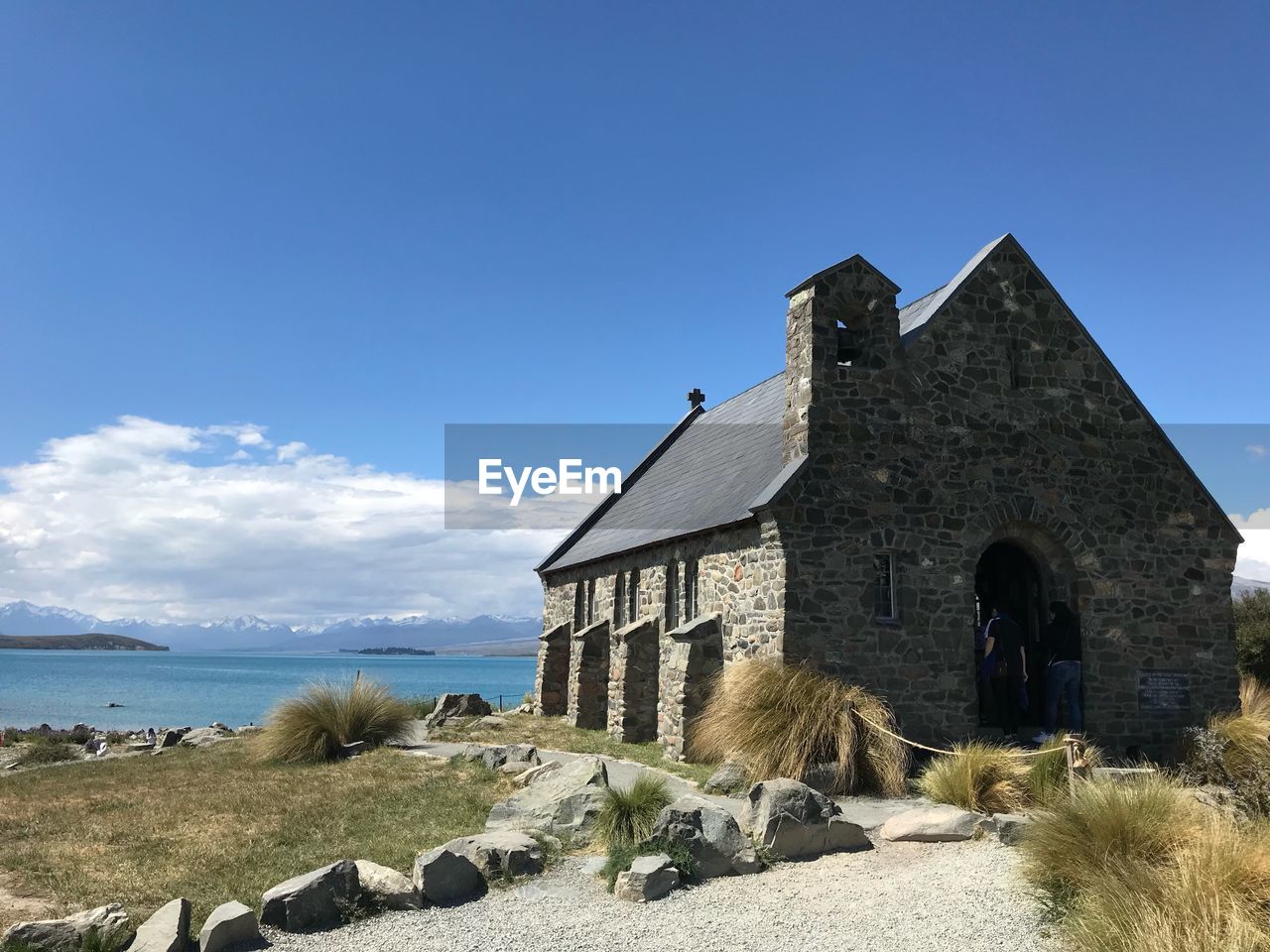 BUILT STRUCTURE BY SEA AGAINST SKY