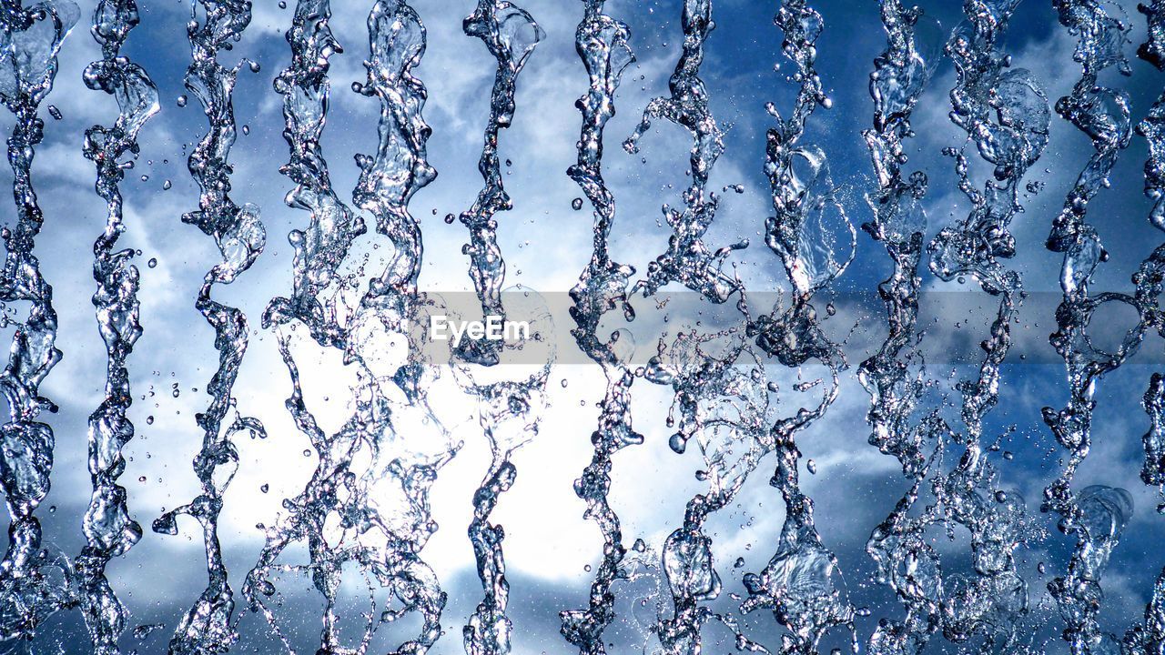 FULL FRAME SHOT OF WATER DROPS ON BLUE