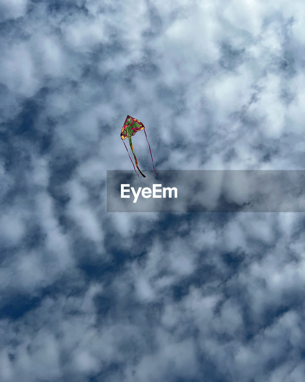 Low angle view of kite flying in sky