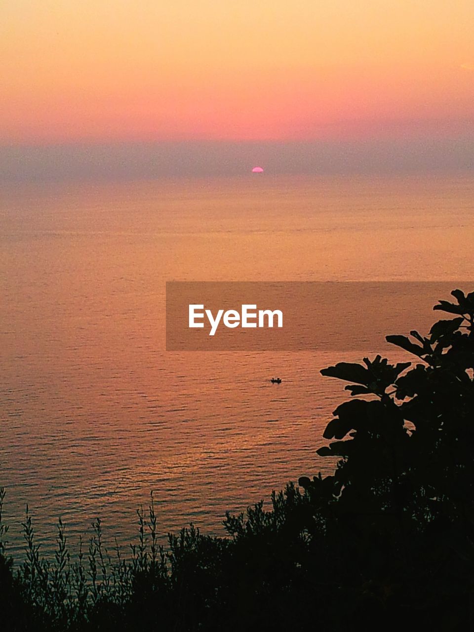 Scenic view of sea against dramatic sky