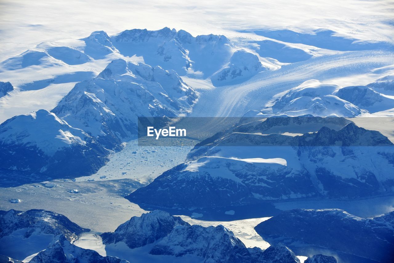 HIGH ANGLE VIEW OF SNOWCAPPED MOUNTAINS