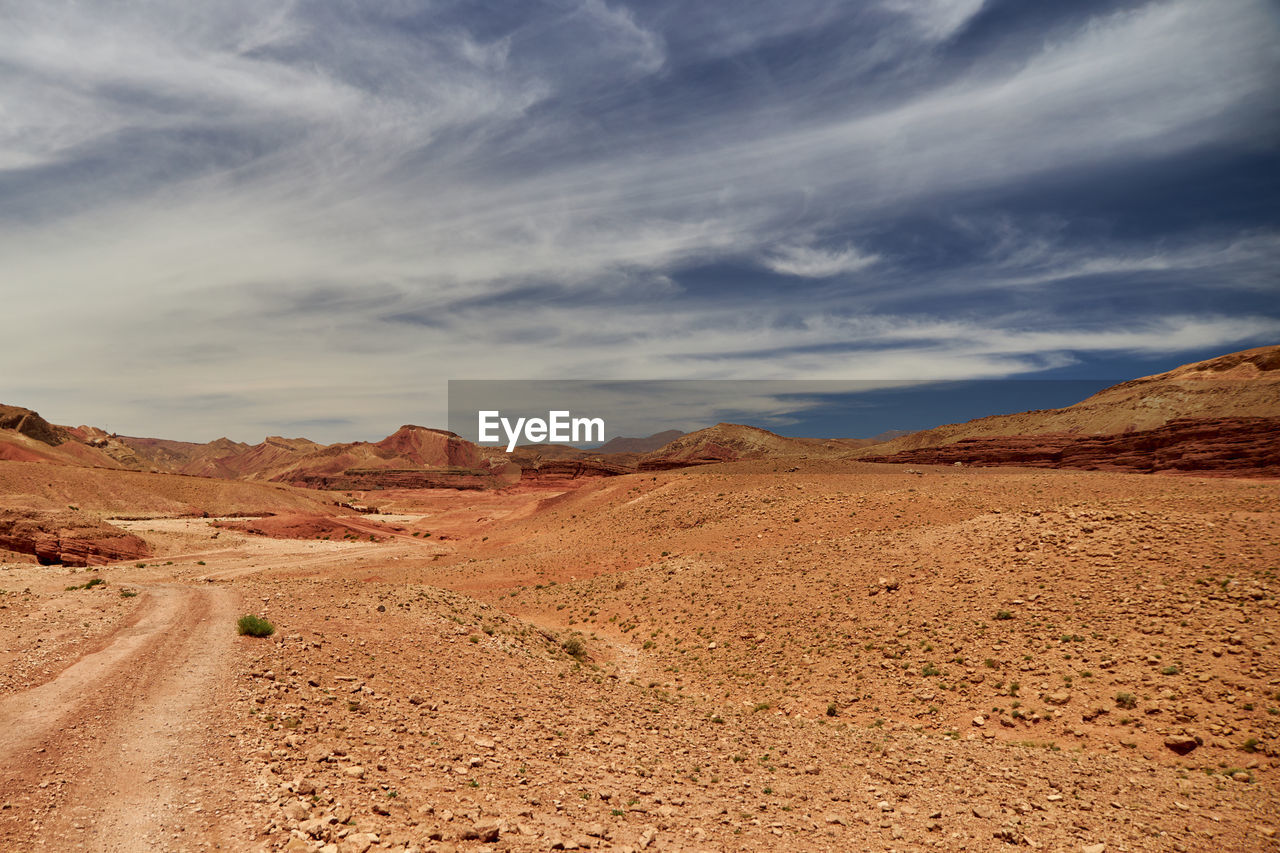 Scenic view of desert against sky atlas mountain morocco