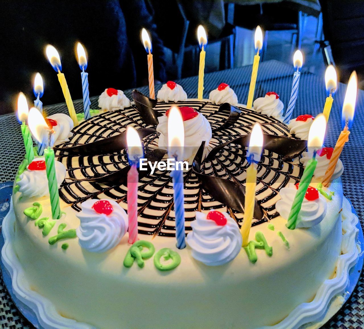 CLOSE-UP OF CAKE WITH CANDLES ON BIRTHDAY