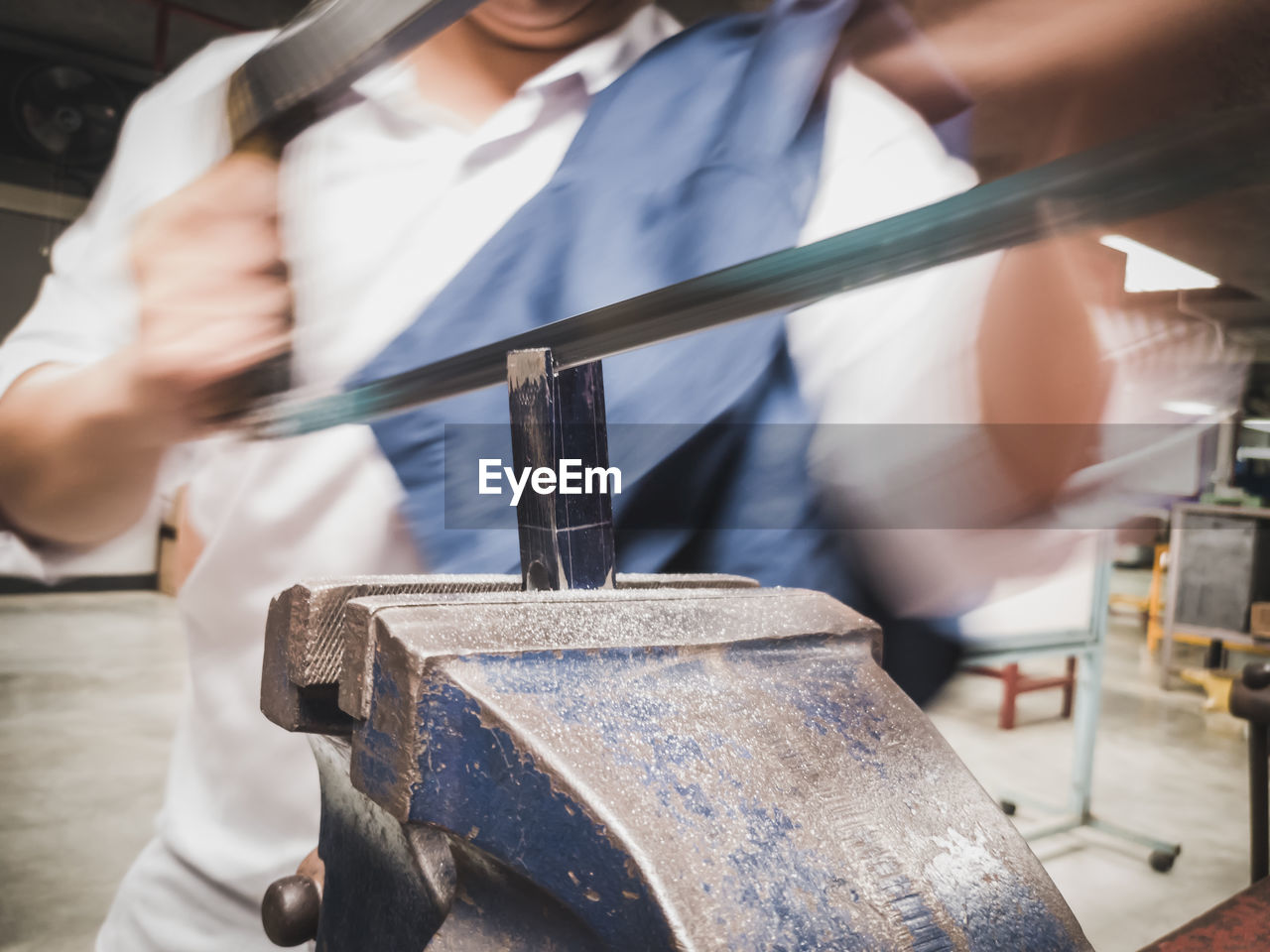 Close-up of man working in workshop