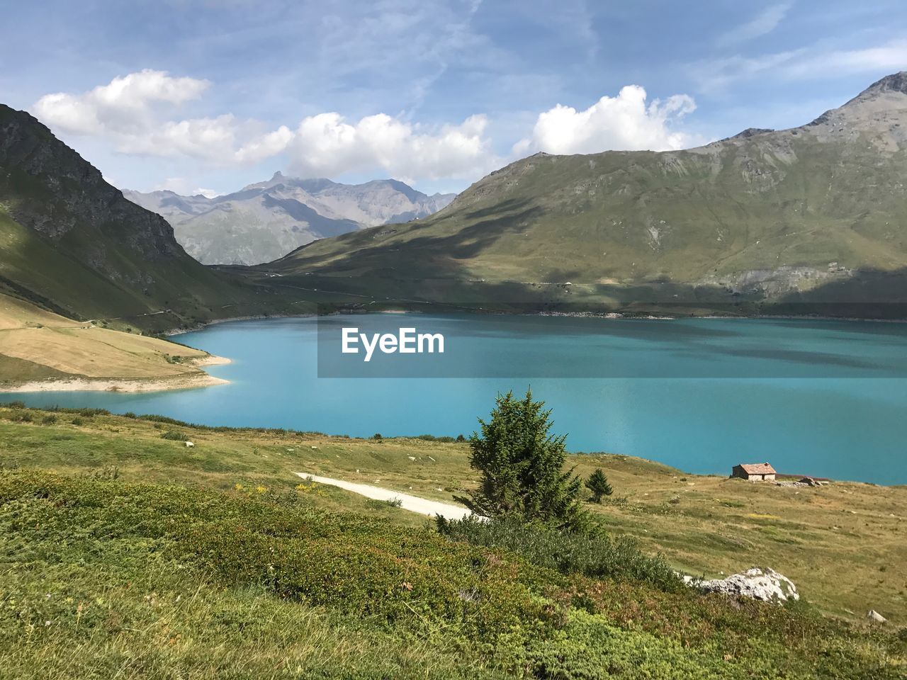 Scenic view of lake and mountains against sky