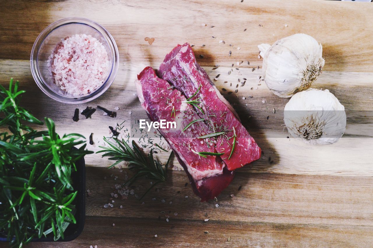 FOOD ON CUTTING BOARD IN KITCHEN