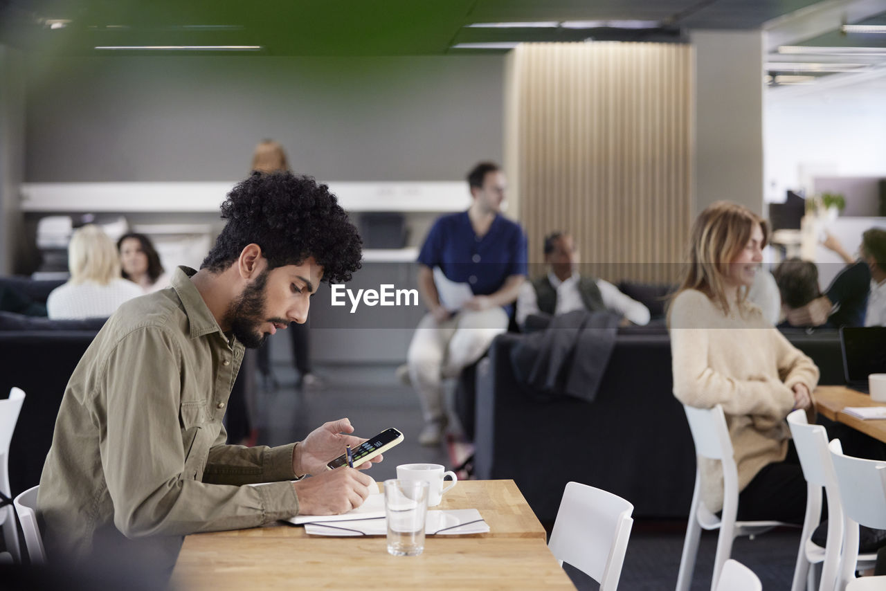 Man working solitary in office cafeteria