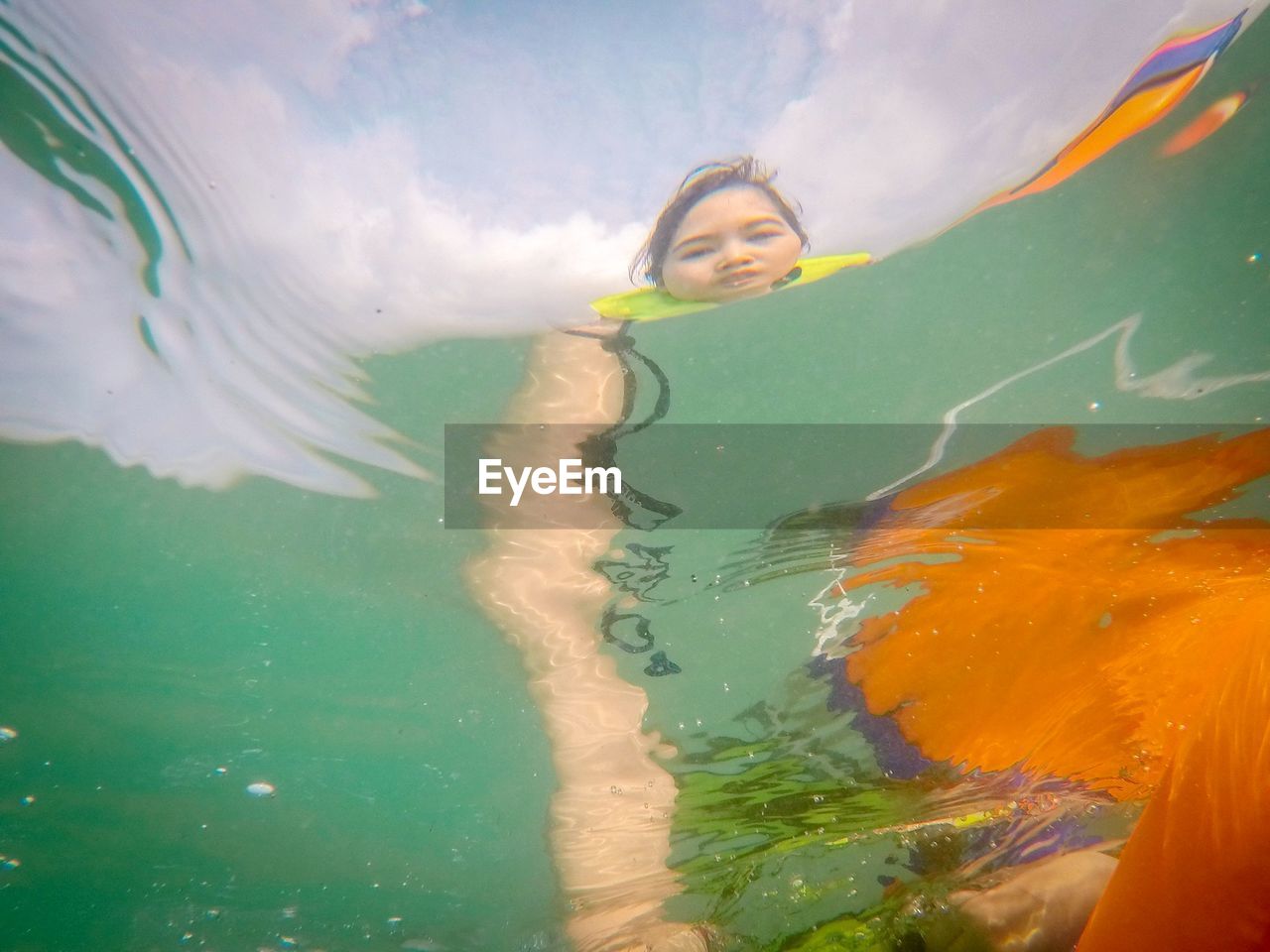 WOMAN SWIMMING IN POOL