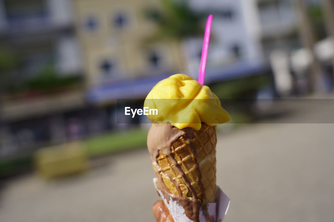 CLOSE-UP OF ICE CREAM CONE ON TABLE DURING WINTER