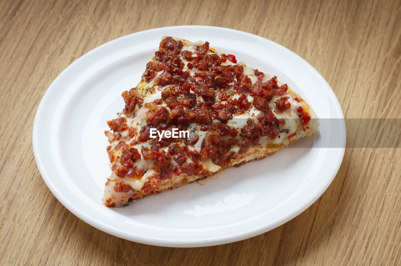 High angle view of pizza in plate on table