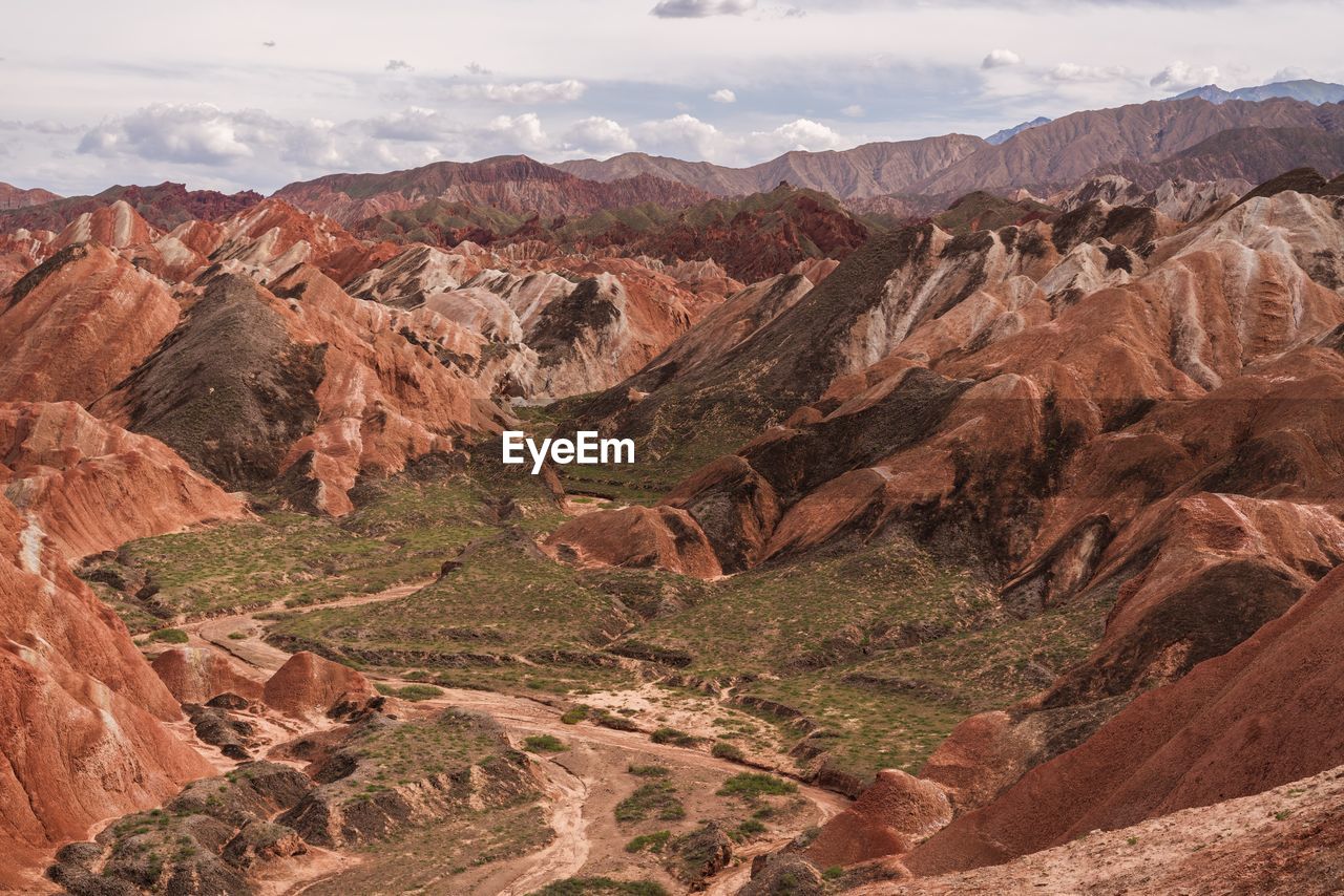 Aerial view of landscape with mountain range in background