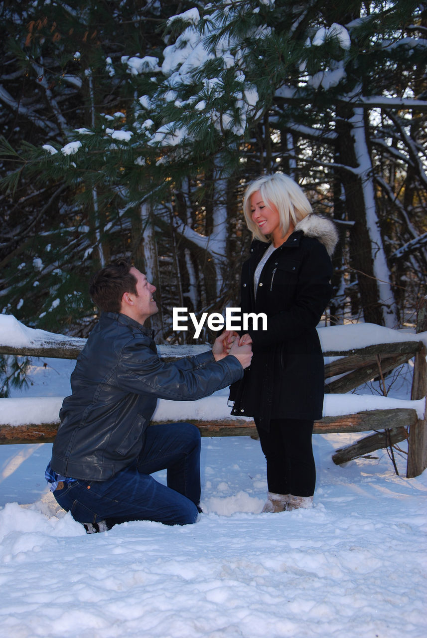 Happy young couple in snow