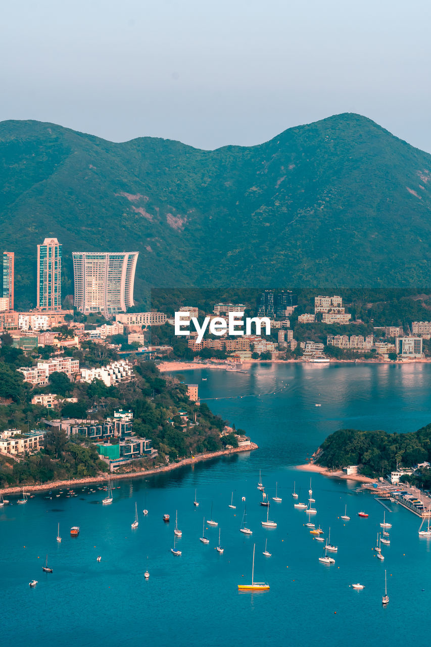 View of boats middle islands buildings in seaside at deep water bay hong kong seen form brick hill 