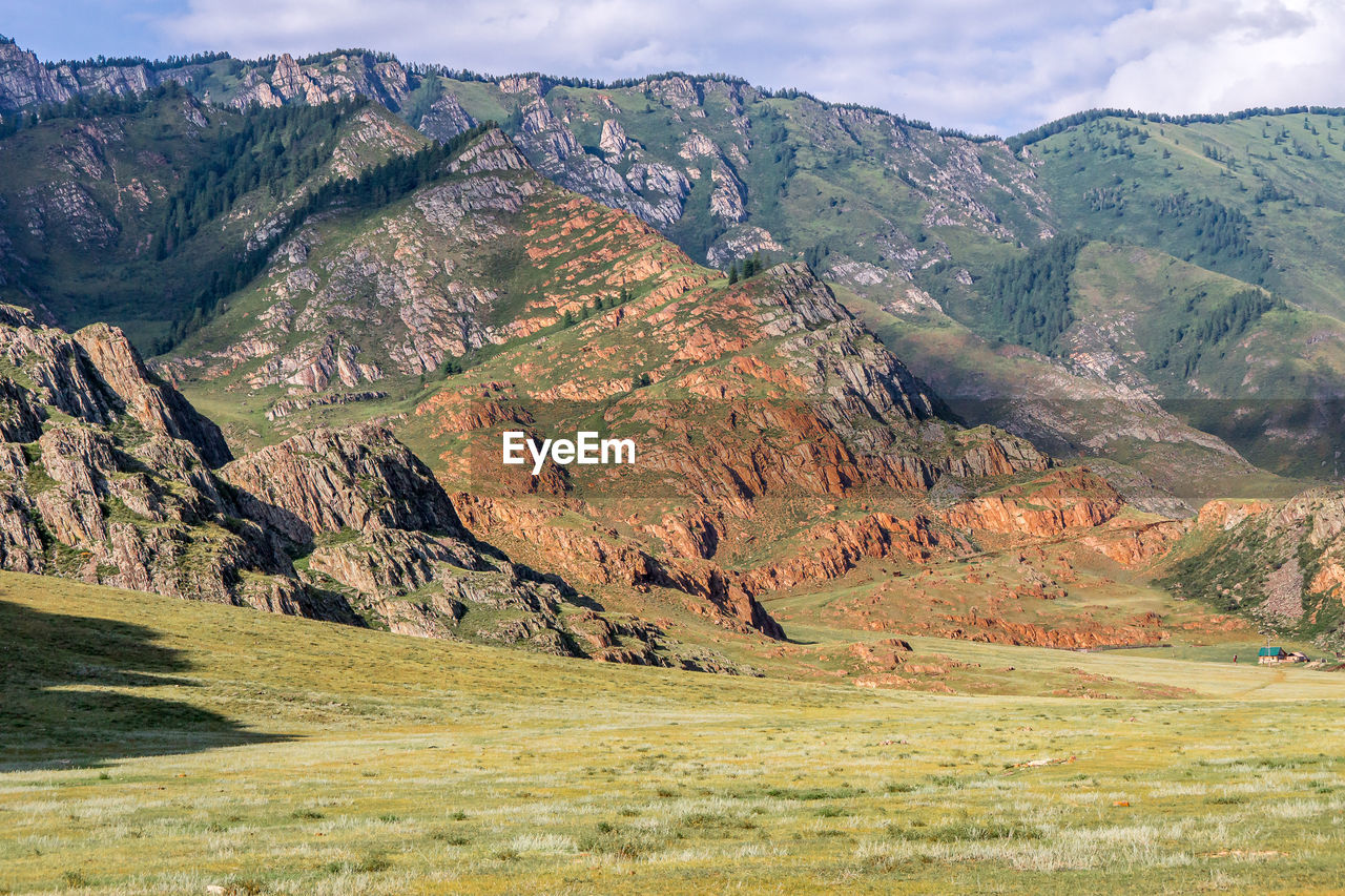 VIEW OF LANDSCAPE AGAINST MOUNTAIN RANGE