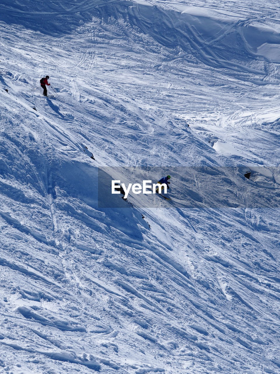 Tourists skiing in snow