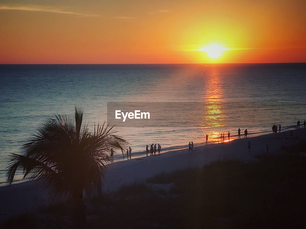 SCENIC VIEW OF SUNSET OVER SEA