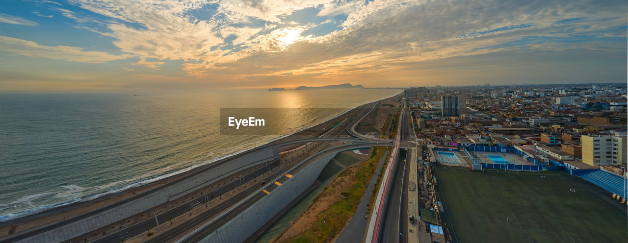 Panoramic night view of the costa verde trail at sunset, in san miguel - lima, peru.