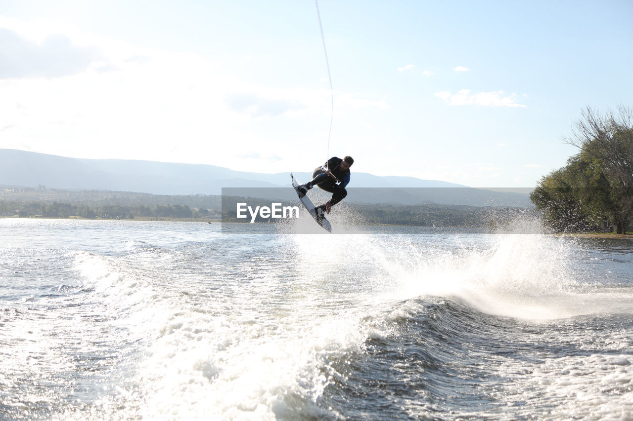 Man wakeboarding, extreme jump - córdoba, argentina.