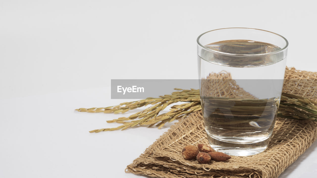 CLOSE-UP OF DRINK IN GLASS