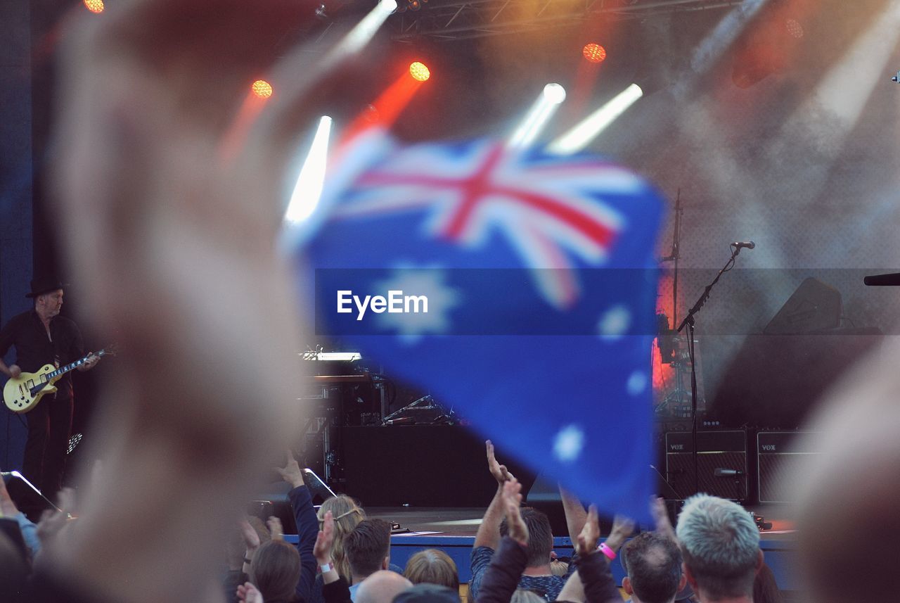 People and australian flag during concert