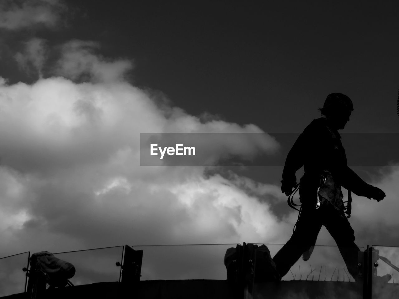 SILHOUETTE MAN AGAINST CLOUDY SKY