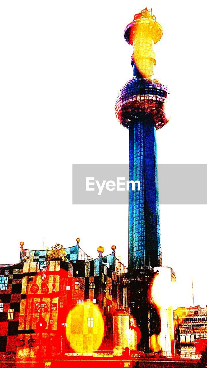 LOW ANGLE VIEW OF ILLUMINATED CITYSCAPE AGAINST SKY