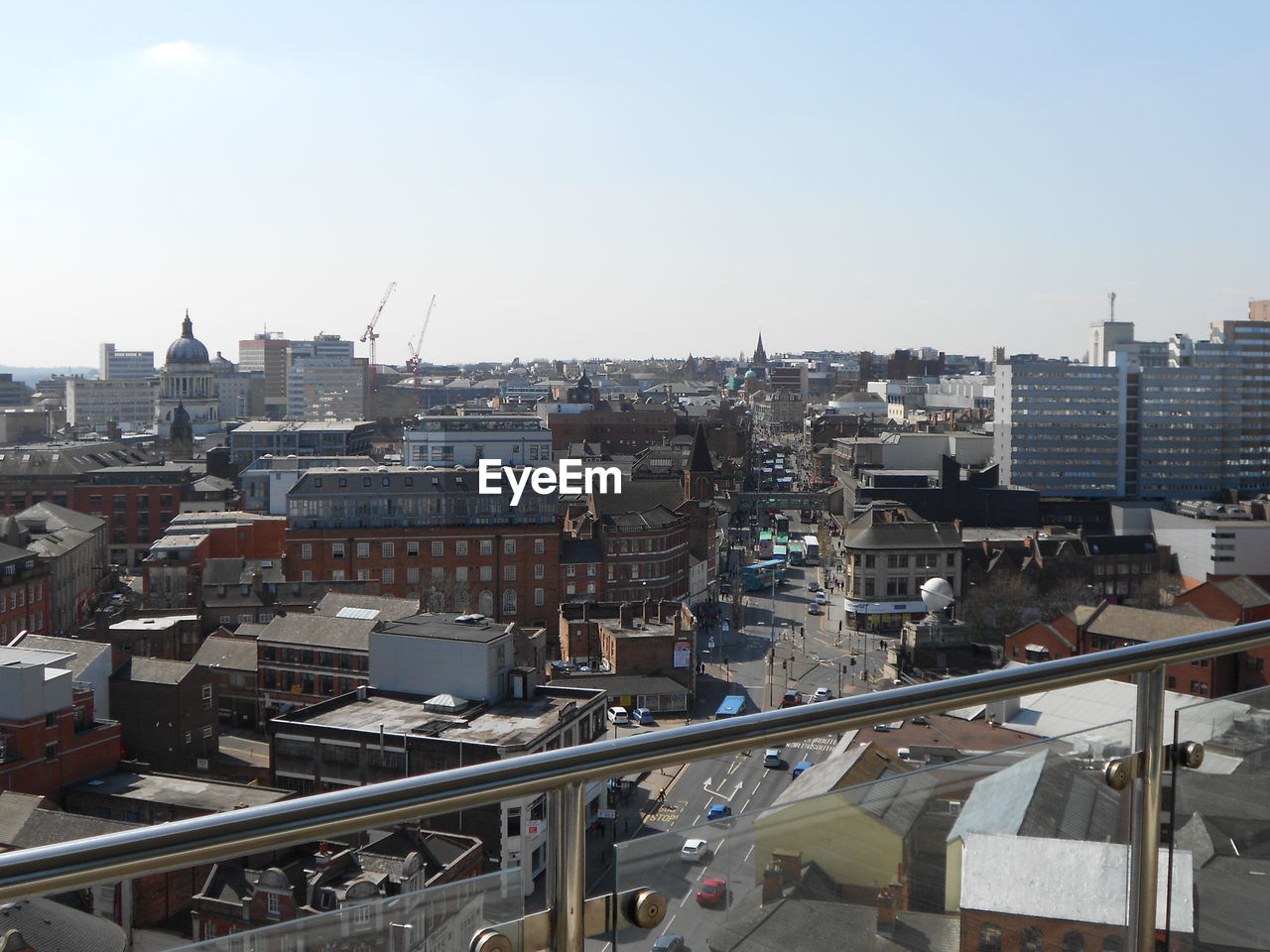 HIGH ANGLE VIEW OF CITYSCAPE AGAINST SKY