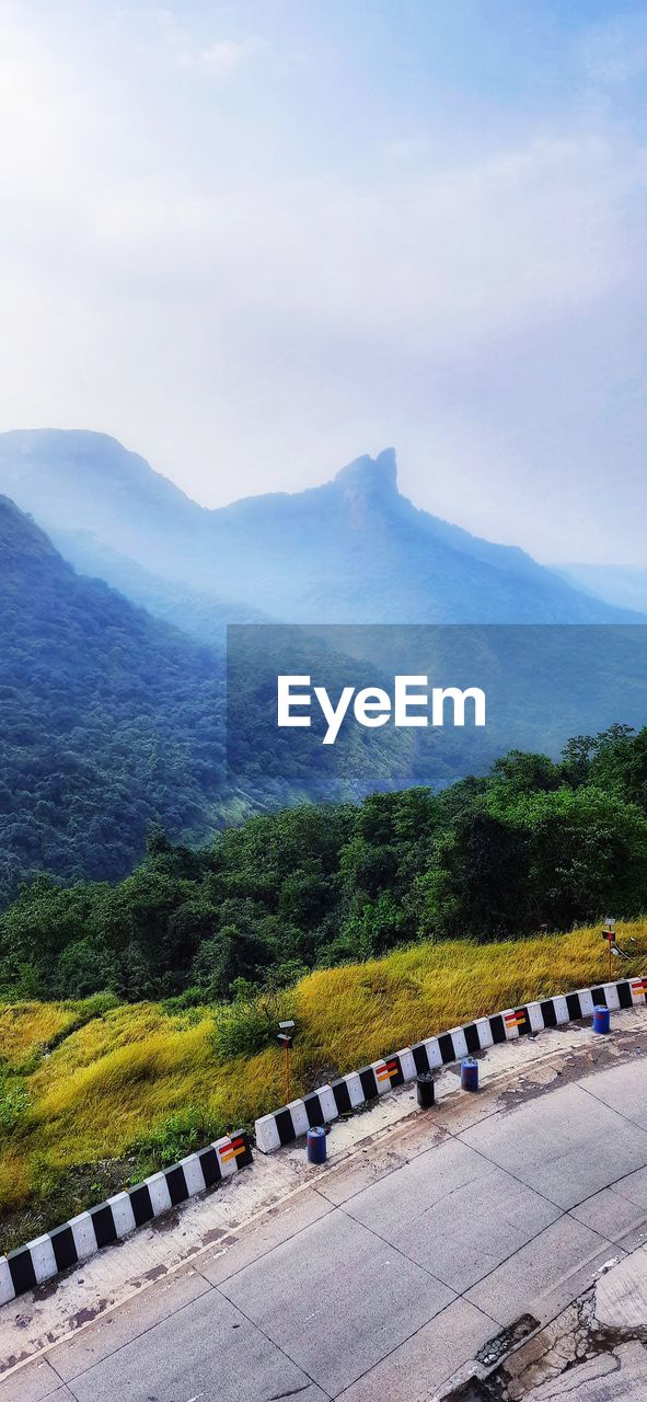 SCENIC VIEW OF MOUNTAIN RANGE AGAINST SKY