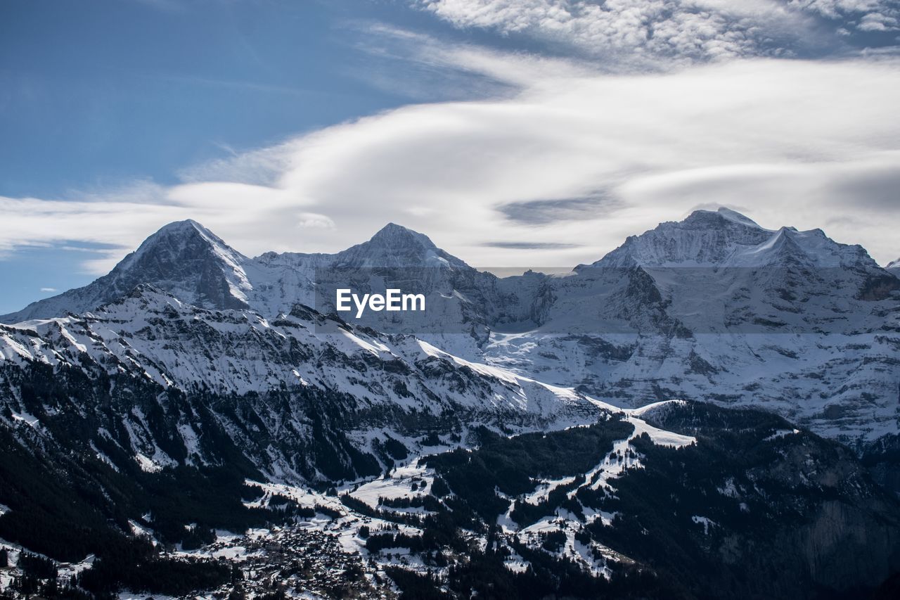 Scenic view of snowcapped mountains against sky