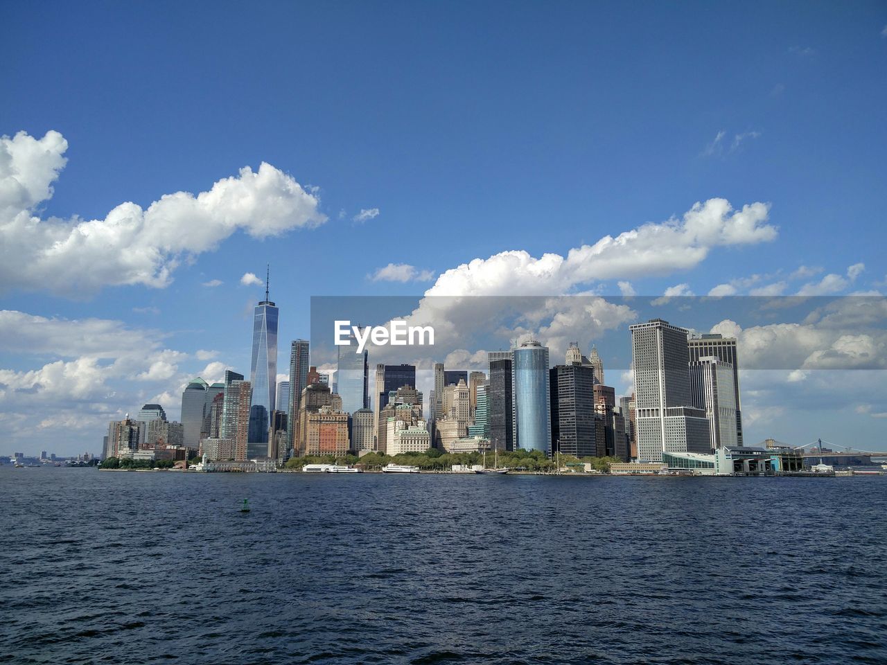 Manhattan skyline on sunny day seen from hudson river