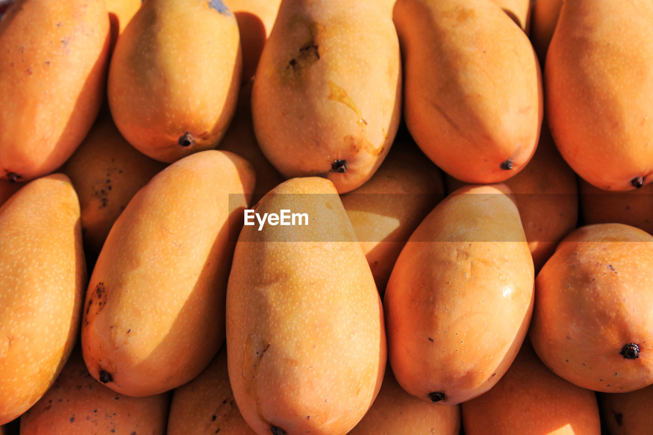 Full frame shot of mangoes for sale at market stall